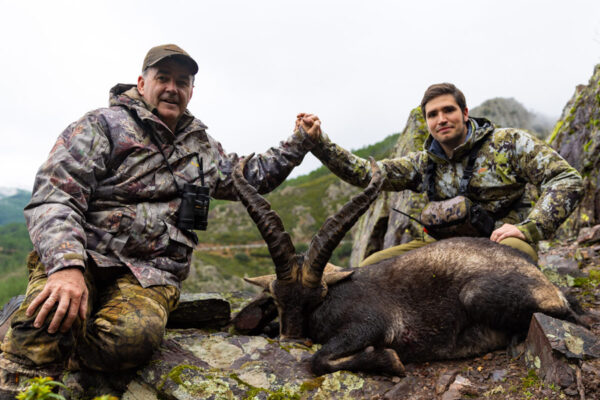 Hunters celebrating a successful Ronda Ibex hunting in Spain with their trophy ibex